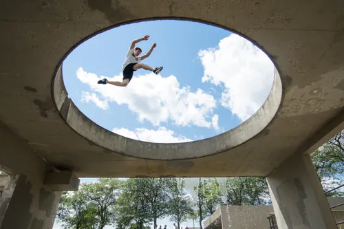 Professional acrobatic performer executing dynamic flip